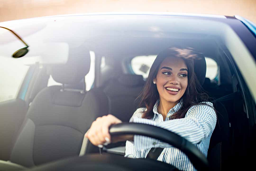 smiling woman driving